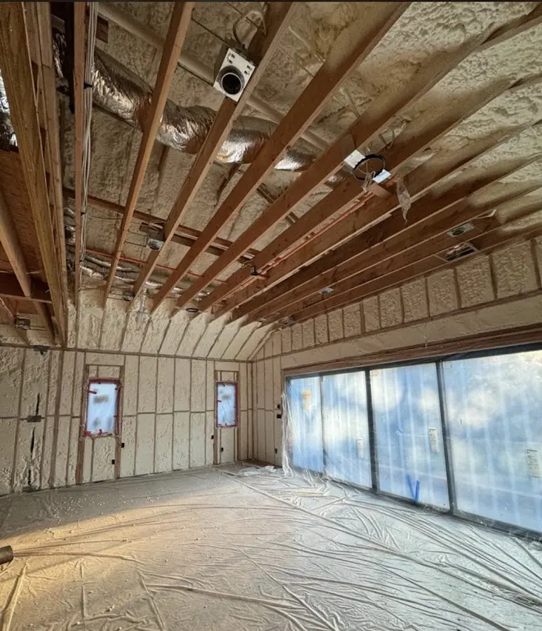 Interior walls and ceiling insulated with spray foam during new construction in Delray Beach